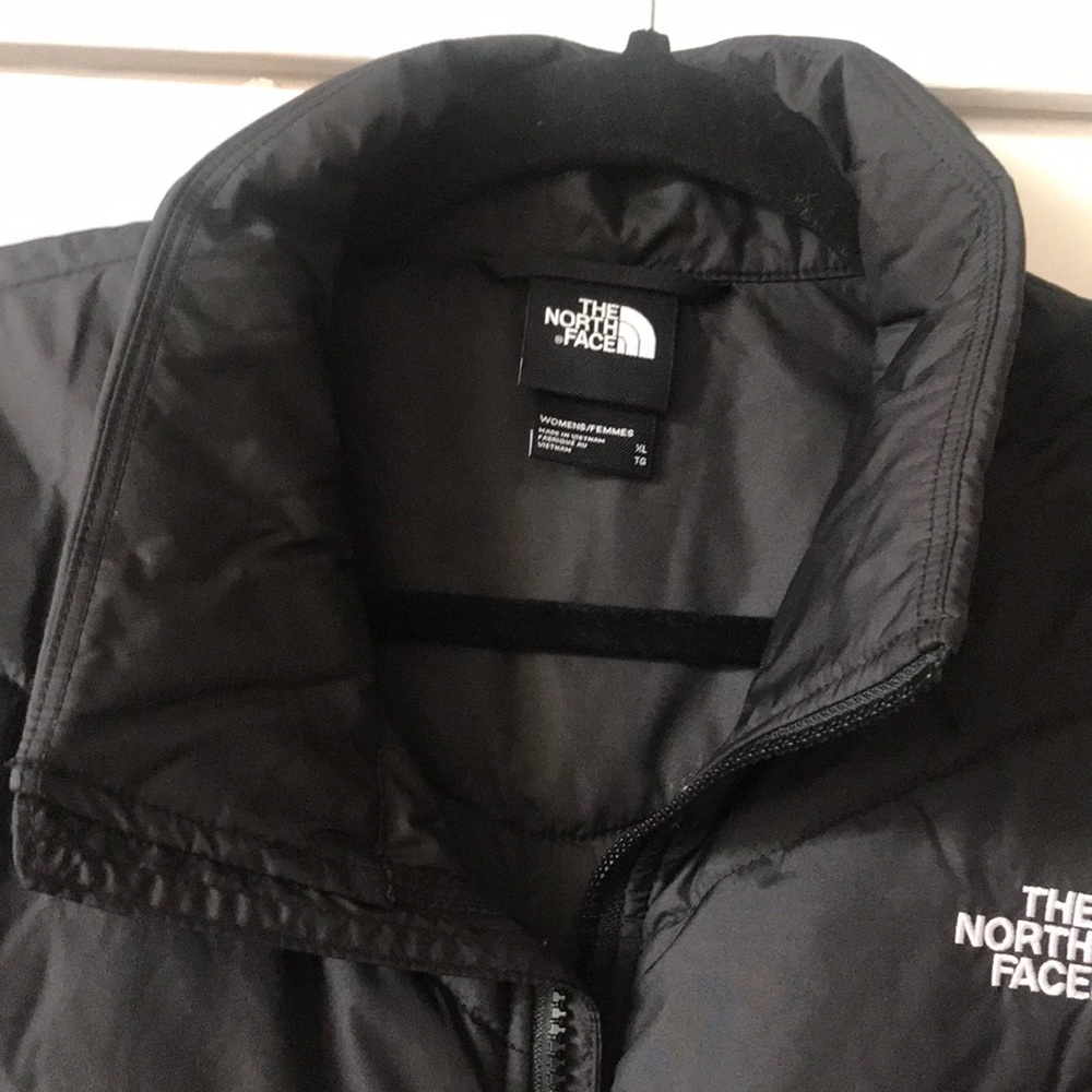 XL women’s black NorthFace vest, inside pockets